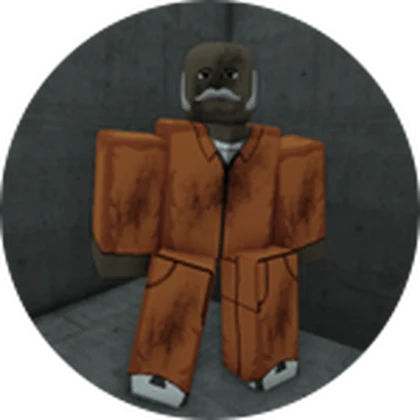 The Free Man standing in an orange prison uniform